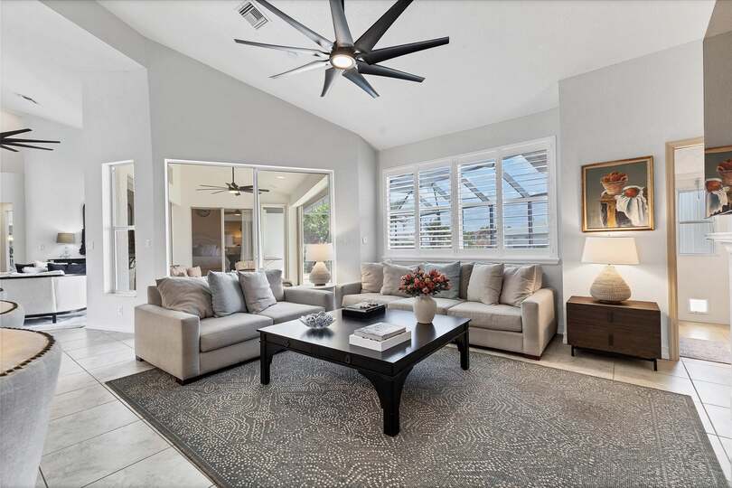 Comfy, Bright Living Room with Electric Fireplace and 65" Smart TV