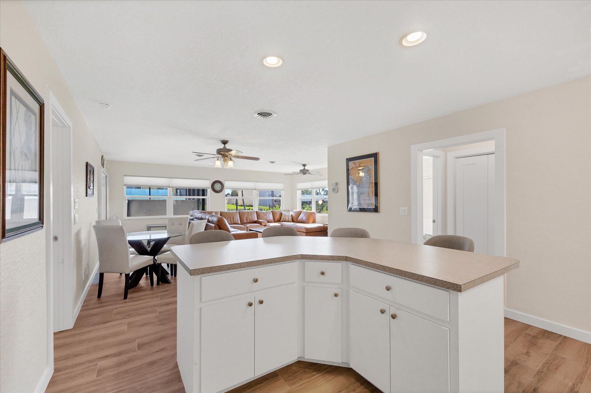 Fully-equipped kitchen overlooking the dining room and living room. Dining table seats 4 with an additional 4 at the kitchen island