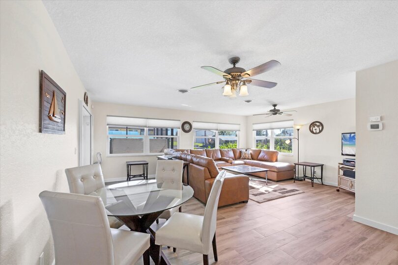 Bright, open living space. Dining table seats 4 with an additional 4 at the kitchen island