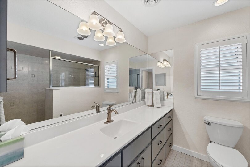 Primary bedroom's attached bathroom with walk-in shower