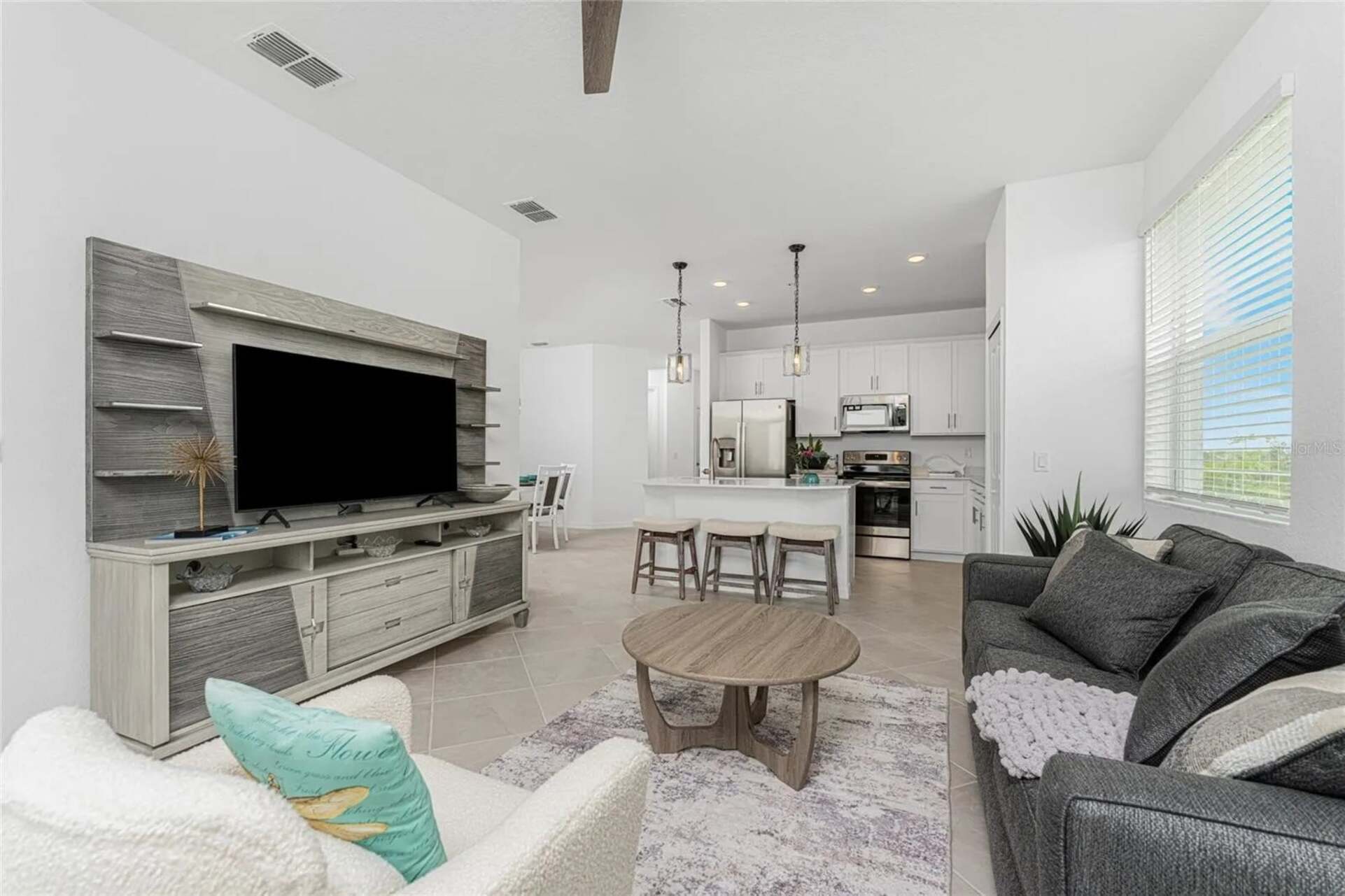 Living room with comfy seating and 55-inch Smart TV