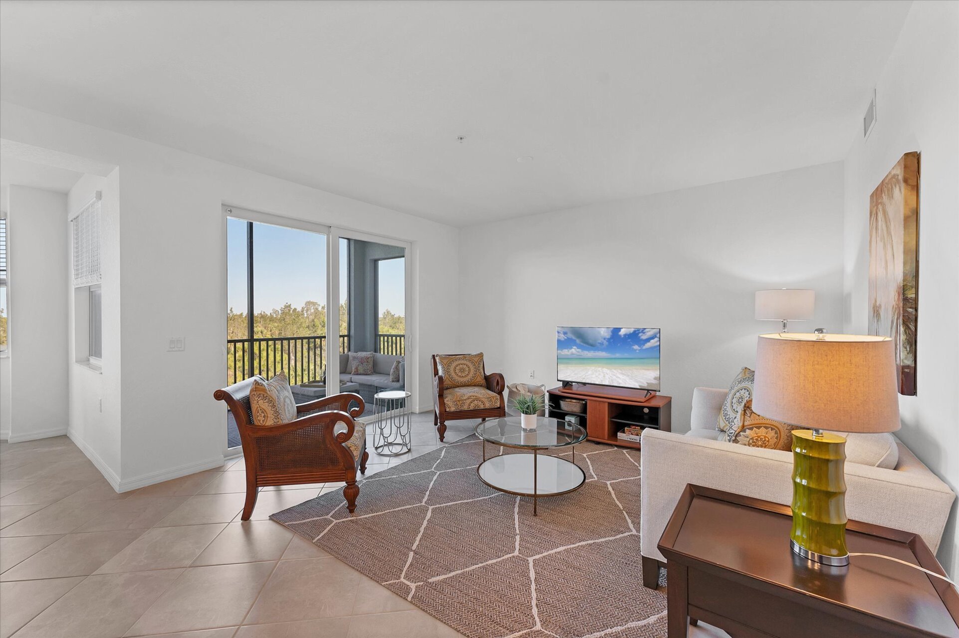Bright, open living space with view of nature preserve