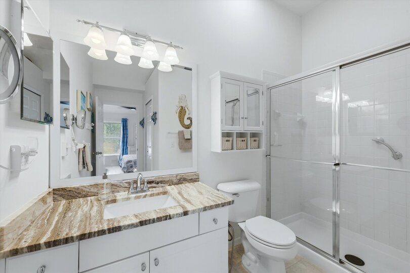 Primary attached bathroom with walk-in shower