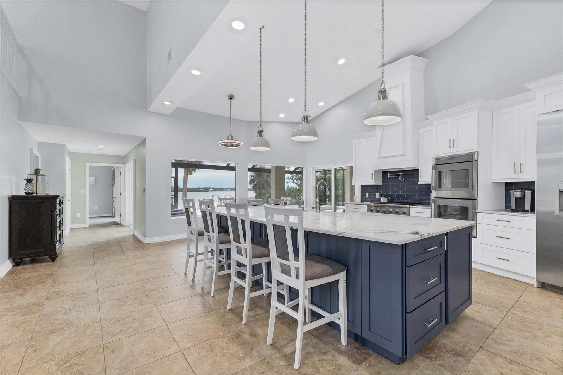 Gorgeous, fully-equipped kitchen features high-end stainless-steel appliances, and plenty of storage and counter top space