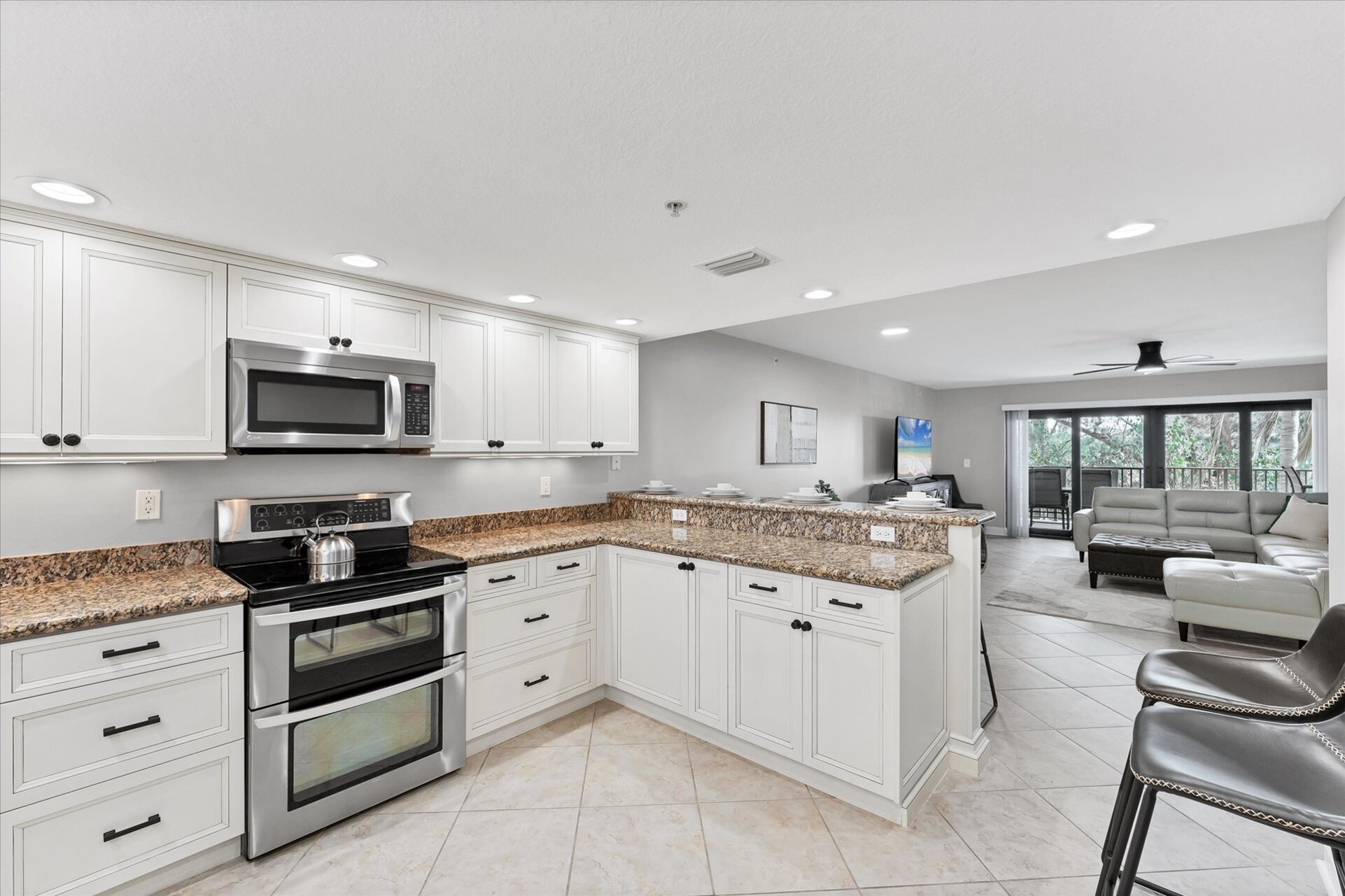 Fully Equipment Kitchen Overlooking the Dining Room & Living Room