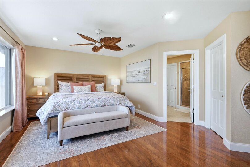 Bedroom 1 - Upstairs king bedroom suite with an amazing view of Peace River, attached bathroom, private balcony, and 55-inch Smart TV