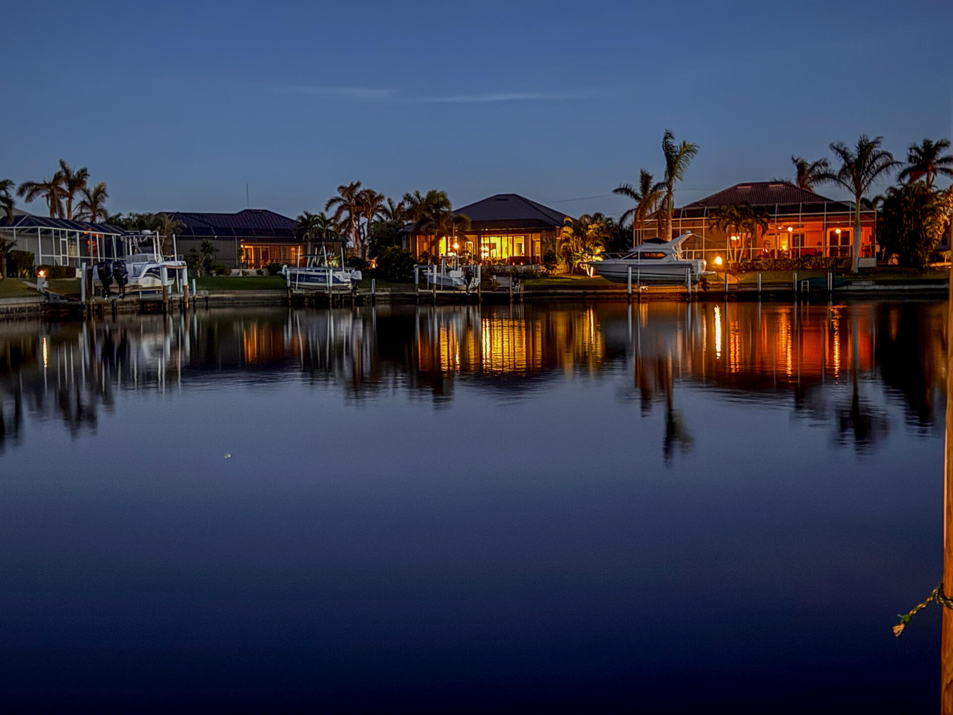 This charming residence features 40 feet of serene waterfront. The wide canal and spacious basin offer quiet waterfront living, complete with privacy from across-canal homes, no boat traffic or wakes.