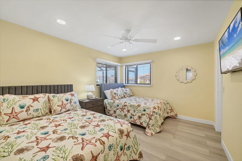 Guest Bedroom with Two Full Beds and 43" Smart TV